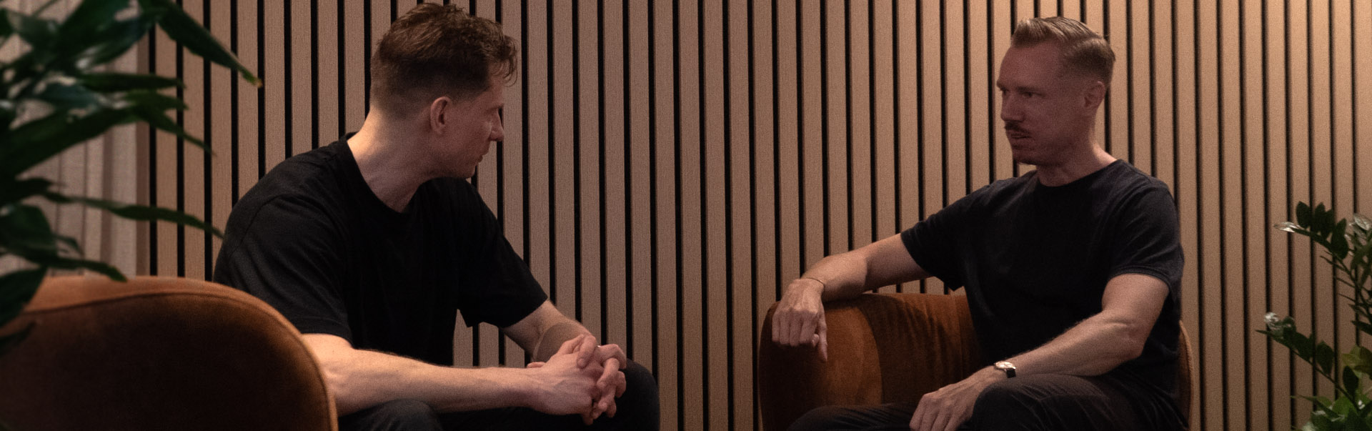 A group of people discussing in front of a whiteboard